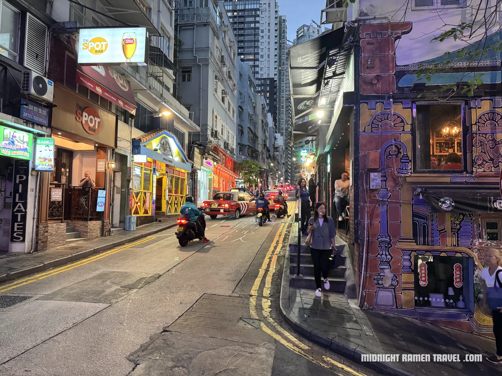 The trendy area of Soho at night with lots of cool bars and restaurants