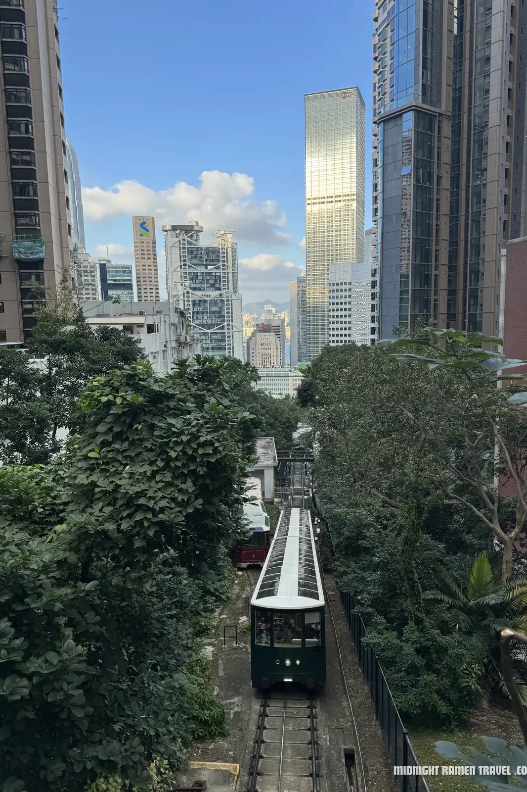 hong kong peak tram ascending central towers uai
