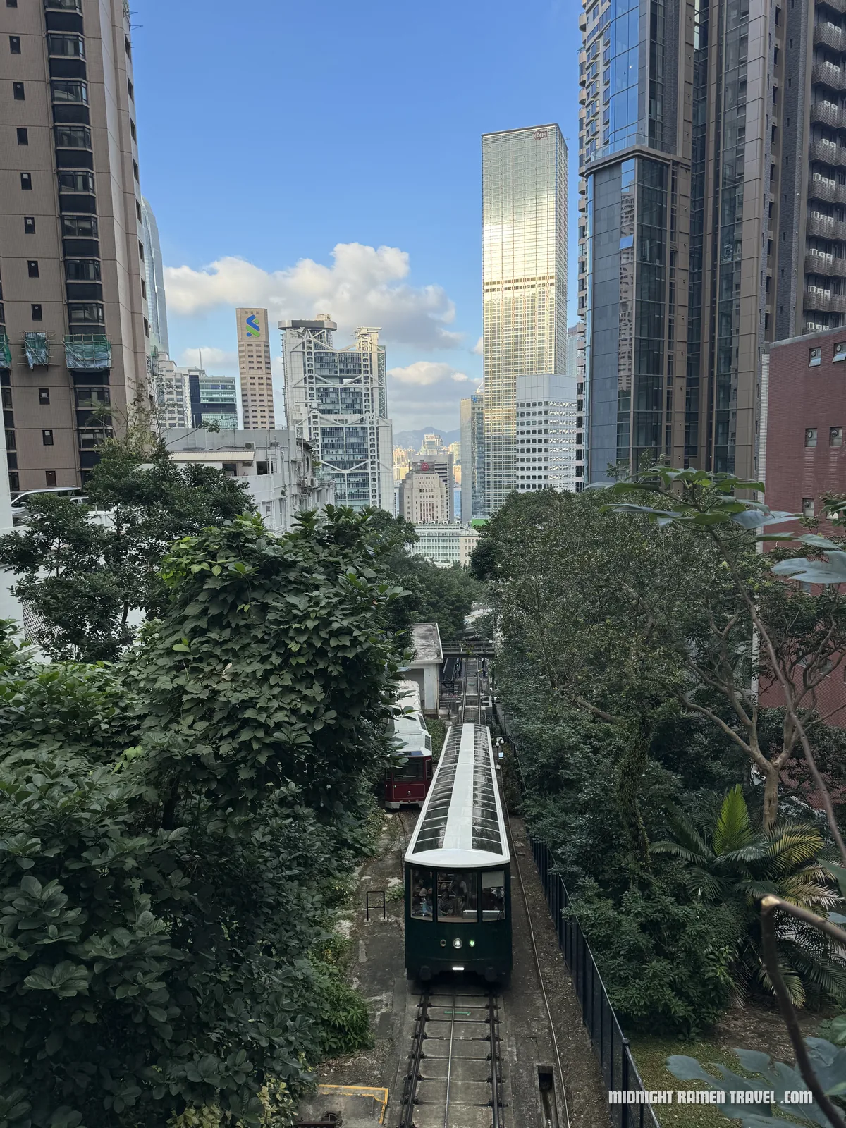 hong kong peak tram ascending central towers