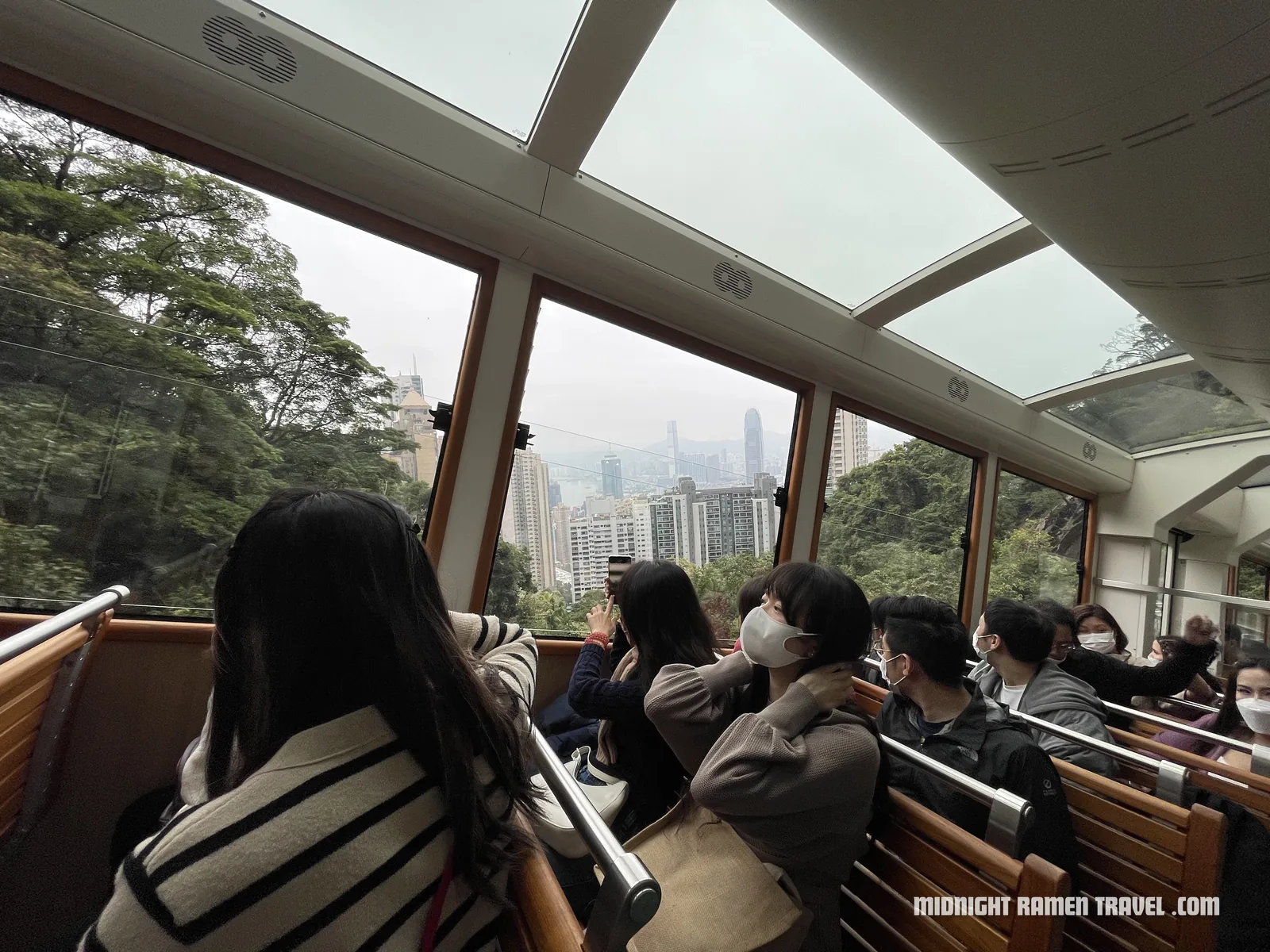 hong kong peak tram interior ascending skyline